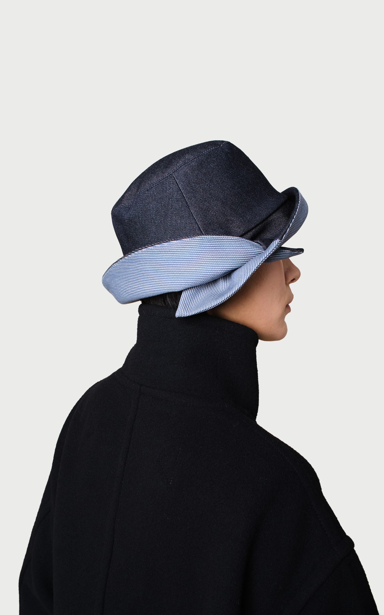 Morning Mist Denim Blue Cross-brim Bucket Hat worn by a model