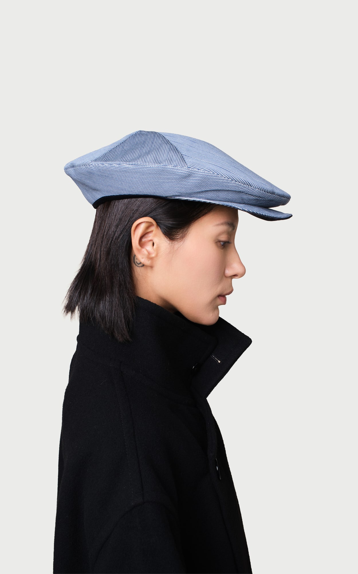 Tidal Denim Blue Pleated Foldable Hat worn by a model