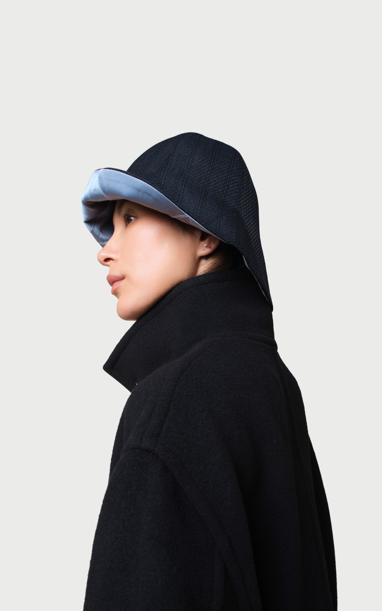 Ink Wash Blue Reversible Bucket Hat worn by a model